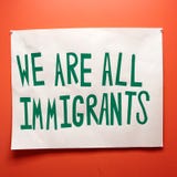 Immigrants and immigration sign with political undertones stock photography Immigrants and immigration sign with political undertones stock photography
