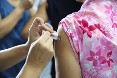 Immunization vaccine injection , doctor inject vaccine to patient arm stock images Immunization vaccine injection , doctor inject vaccine to patient arm stock images