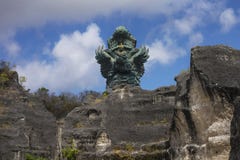 Impressive view of Garuda Wisnu green copper statue inspired in Hindu myth standing majestic under a blue sky in Indonesia travel stock photos Impressive view of Garuda Wisnu green copper statue inspired in Hindu myth standing majestic under a blue sky in Indonesia travel stock photos