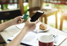 In Selective Of Mobile Phone Was Holding By Right Hand And Blurred Credit Card At The Left Hand,for Shopping Online Stock Photo In Selective Of Mobile Phone Was Holding By Right Hand And Blurred Credit Card At The Left Hand,for Shopping Online Stock Photo