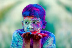 Indian child playing with the color in holi festival stock image Indian child playing with the color in holi festival stock image