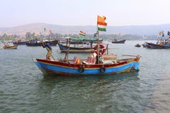 Indian fishermen and tricolor with his boat, Harne bandar, Fatehgad, Kokan royalty free stock photography Indian fishermen and tricolor with his boat, Harne bandar, Fatehgad, Kokan royalty free stock photography