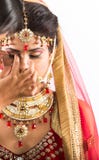 Indian model-bride getting ready for shoot stock image Indian model-bride getting ready for shoot stock image