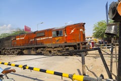Indian Railway Train Passes A Level Crossing Royalty Free Stock Photography Indian Railway Train Passes A Level Crossing Royalty Free Stock Photography