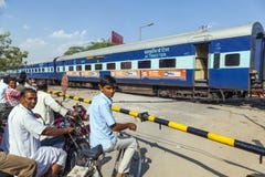 Indian Railway Train Passes A Railroad Crossing Stock Photos Indian Railway Train Passes A Railroad Crossing Stock Photos