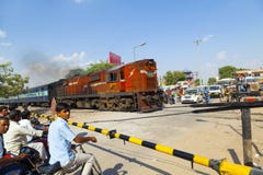 Indian Railway Train Passes A Railroad Crossing Royalty Free Stock Image Indian Railway Train Passes A Railroad Crossing Royalty Free Stock Image