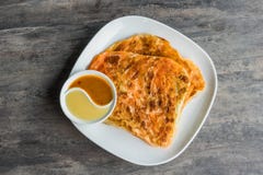 Indian Roti Prata with Condensed milk and Curry Sauce stock photo Indian Roti Prata with Condensed milk and Curry Sauce stock photo