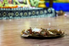 Indian Rupees collected on a plate as offering to Hindu God. stock photography Indian Rupees collected on a plate as offering to Hindu God. stock photography