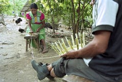 Indian seniors braiding wicker baskets for sale stock images Indian seniors braiding wicker baskets for sale stock images