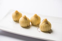 Indian sweet food called modak prepared specifically in ganesh festival or ganesh chaturthi stock photo Indian sweet food called modak prepared specifically in ganesh festival or ganesh chaturthi stock photo