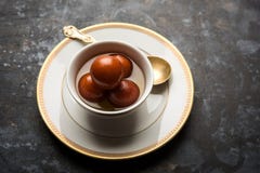 Indian sweet Gulab Jamun served in a ceramic bowl, selective focus stock image Indian sweet Gulab Jamun served in a ceramic bowl, selective focus stock image