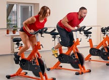 Indoor bycicle cycling in gym royalty free stock images Indoor bycicle cycling in gym royalty free stock images