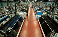 Industria tessile (denim) - tessendo fotografia stock Industria tessile (denim) - tessendo fotografia stock