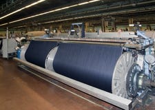 Industria tessile (denim) - tessendo immagini stock Industria tessile (denim) - tessendo immagini stock