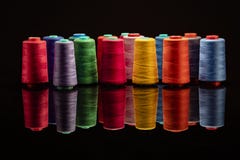 Industrial spools arranged on black backgroud stock photography Industrial spools arranged on black backgroud stock photography