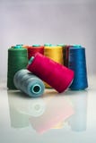 Industrial colored spools arranged on white backgroud stock photography Industrial colored spools arranged on white backgroud stock photography