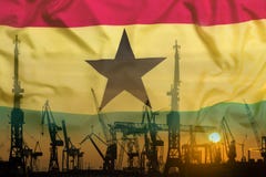 Industrial concept with Ghana flag at sunset royalty free stock photo Industrial concept with Ghana flag at sunset royalty free stock photo