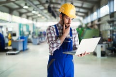 Industrial factory employee working in metal manufacturing industry Stock Photo Industrial factory employee working in metal manufacturing industry Stock Photo