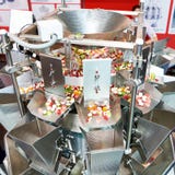 Industrial Filling Machine For Dry Candy Products In Food Production Stock Photography Industrial Filling Machine For Dry Candy Products In Food Production Stock Photography