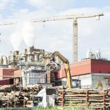 Industrial plant of a furniture factory with smoking smokestacks royalty free stock image Industrial plant of a furniture factory with smoking smokestacks royalty free stock image