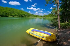 Inflatable Boat On A Mountain Lake Stock Photos