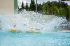 Inflatable Bot Splashing in the Swimming Pool at the Water Park stock photo Inflatable Bot Splashing in the Swimming Pool at the Water Park stock photo