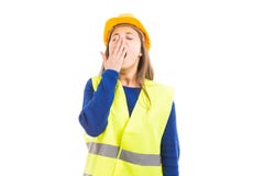 Ingeniero o arquitecto de sexo femenino joven que bosteza foto de archivo libre de regalías Ingeniero o arquitecto de sexo femenino joven que bosteza foto de archivo libre de regalías