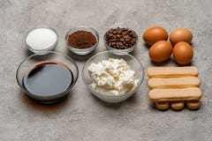 Ingredients for cooking tiramisu - Savoiardi biscuit cookies, mascarpone, cheese, sugar, cocoa, coffee and egg royalty free stock photography Ingredients for cooking tiramisu - Savoiardi biscuit cookies, mascarpone, cheese, sugar, cocoa, coffee and egg royalty free stock photography