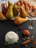 Ingredients For Making Homemade Pie With Ricotta Cheese, Cardamom, Cinnamon, Cognac And Pear. Home Upper View. Vertical Stock Photography
