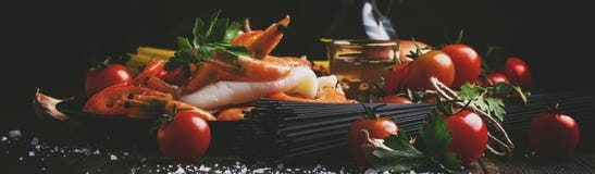 Ingredients For The Preparation Black Pasta With Seafood, Tomatoes And White Dry Wine, Black Food Cooking Background, Still Life, Stock Images