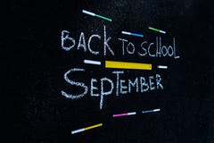 The inscription on the asphalt with white chalk back to school, colorful markers and yellow line vector illustration The inscription on the asphalt with white chalk back to school, colorful markers and yellow line vector illustration