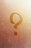 The inscription on glass, question mark concept. Question sign is painted on the surface of misted and wet window royalty free stock image The inscription on glass, question mark concept. Question sign is painted on the surface of misted and wet window royalty free stock image