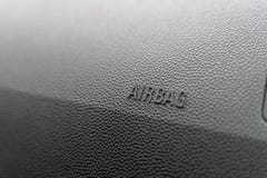 Inskrypcja na panelu pojazdu airbag tło popielaty textured klingeryt obrazy stock Inskrypcja na panelu pojazdu airbag tło popielaty textured klingeryt obrazy stock