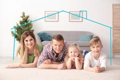 Insurance concept. Contour of house around happy family stock photo Insurance concept. Contour of house around happy family stock photo