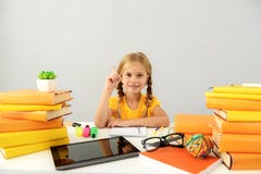 Intelligent child sitting at the desk with books royalty free stock photos Intelligent child sitting at the desk with books royalty free stock photos