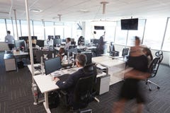 Interior Of Busy Modern Open Plan Office With Staff royalty free stock photography Interior Of Busy Modern Open Plan Office With Staff royalty free stock photography