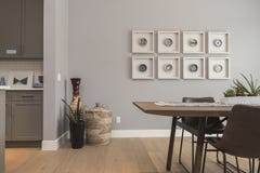 Interior shot of a modern house dining room with art on the wall