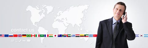 International contact us concept, businessman with mobile phone isolated on world map background, flags icons and contact symbols stock image International contact us concept, businessman with mobile phone isolated on world map background, flags icons and contact symbols stock image