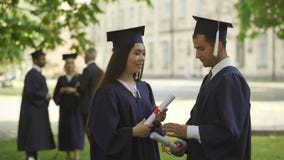 International graduates with diplomas having conversation, studying on exchange stock footage International graduates with diplomas having conversation, studying on exchange stock footage