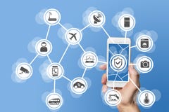 Internet of things security concept illustrated by hand holding modern smart phone with connected sensors in objects Stock Photos Internet of things security concept illustrated by hand holding modern smart phone with connected sensors in objects Stock Photos