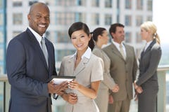 Interracial Business Team with Tablet Computer stock images Interracial Business Team with Tablet Computer stock images