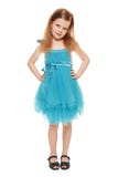 Intégral une petite fille adorable dans la robe bleue, d'isolement sur le fond blanc photographie stock Intégral une petite fille adorable dans la robe bleue, d'isolement sur le fond blanc photographie stock