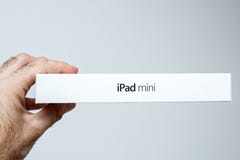 IPad mini in hipster's hairy hand. stock photo IPad mini in hipster's hairy hand. stock photo