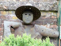 Iron scarecrow standing against garden wall at Chenies Manor House stock image Iron scarecrow standing against garden wall at Chenies Manor House stock image