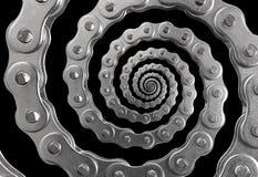 Isolated on black silver metal stainless chain twisted into spiral pattern background. Abstract chain mechanism swirl fractal. Sur royalty free stock photography Isolated on black silver metal stainless chain twisted into spiral pattern background. Abstract chain mechanism swirl fractal. Sur royalty free stock photography