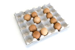 An isolated close-up of brown chicken eggs lay in a cardboard tray in the form of the number 21. Easter Concept stock photography An isolated close-up of brown chicken eggs lay in a cardboard tray in the form of the number 21. Easter Concept stock photography