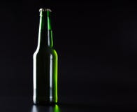 light green beer bottle on a black stock image light green beer bottle on a black stock image