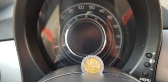 New shekels coin of 10 on sport car speedometer dashboard stock images New shekels coin of 10 on sport car speedometer dashboard stock images