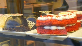 Istanbul, Turkey - June 11, 2019: Designer cakes and cakes on the counter of expensive pastry and sweets store stock video footage Istanbul, Turkey - June 11, 2019: Designer cakes and cakes on the counter of expensive pastry and sweets store stock video footage