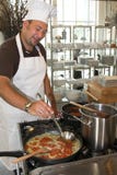 Italian chef cooking pasta